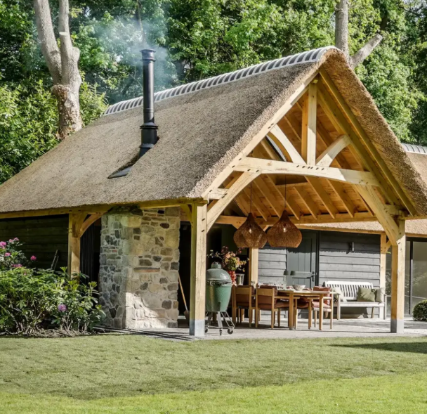 Lounge area under an oak framed building with the frame left exposed