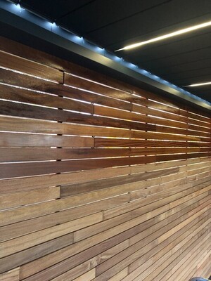 Applying hardwood decking oil to protect Ipe decking Before and after applying hardwood decking oil to Ipe decking
